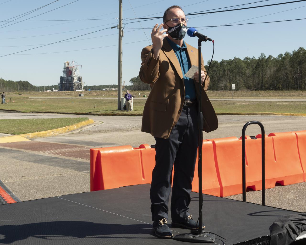 Rick Gilbrech, director of NASA's Stennis Space Center, speaks to invited guests ahead of a second hot fire test of the core stage for the first flight of NASA’s Space Launch System rocket in the B-2 Test Stand, Thursday, March 18, 2021, at NASA’s Stennis Space Center near Bay St. Louis, Mississippi. The hot fire test is the final stage of the Green Run test series, a comprehensive assessment of the Space Launch System’s core stage prior to launching the Artemis I mission to the Moon.  Photo Credit: (NASA/Robert Markowitz)