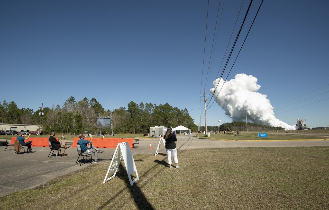 Invited guests watch as the core stage for the first flight of NASA’s Space Launch System rocket undergoes a second hot fire test in the B-2 Test Stand, Thursday, March 18, 2021, at NASA’s Stennis Space Center near Bay St. Louis, Mississippi. The four RS-25 engines fired for the full-duration of 8 minutes during the test and generated 1.6 million pounds of thrust. The hot fire test is the final stage of the Green Run test series, a comprehensive assessment of the Space Launch System’s core stage prior to launching the Artemis I mission to the Moon. Photo Credit: (NASA/Robert Markowitz)