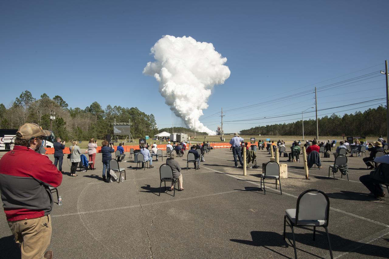 Invited guests watch as the core stage for the first flight of NASA’s Space Launch System rocket undergoes a second hot fire test in the B-2 Test Stand, Thursday, March 18, 2021, at NASA’s Stennis Space Center near Bay St. Louis, Mississippi. The four RS-25 engines fired for the full-duration of 8 minutes during the test and generated 1.6 million pounds of thrust. The hot fire test is the final stage of the Green Run test series, a comprehensive assessment of the Space Launch System’s core stage prior to launching the Artemis I mission to the Moon. Photo Credit: (NASA/Robert Markowitz)