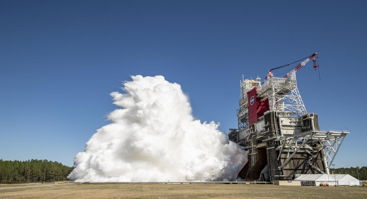The core stage for the first flight of NASA’s Space Launch System rocket is seen in the B-2 Test Stand during a second hot fire test, Thursday, March 18, 2021, at NASA’s Stennis Space Center near Bay St. Louis, Mississippi. The four RS-25 engines fired for the full-duration of 8 minutes during the test and generated 1.6 million pounds of thrust. The hot fire test is the final stage of the Green Run test series, a comprehensive assessment of the Space Launch System’s core stage prior to launching the Artemis I mission to the Moon. Photo Credit: (NASA/Robert Markowitz)