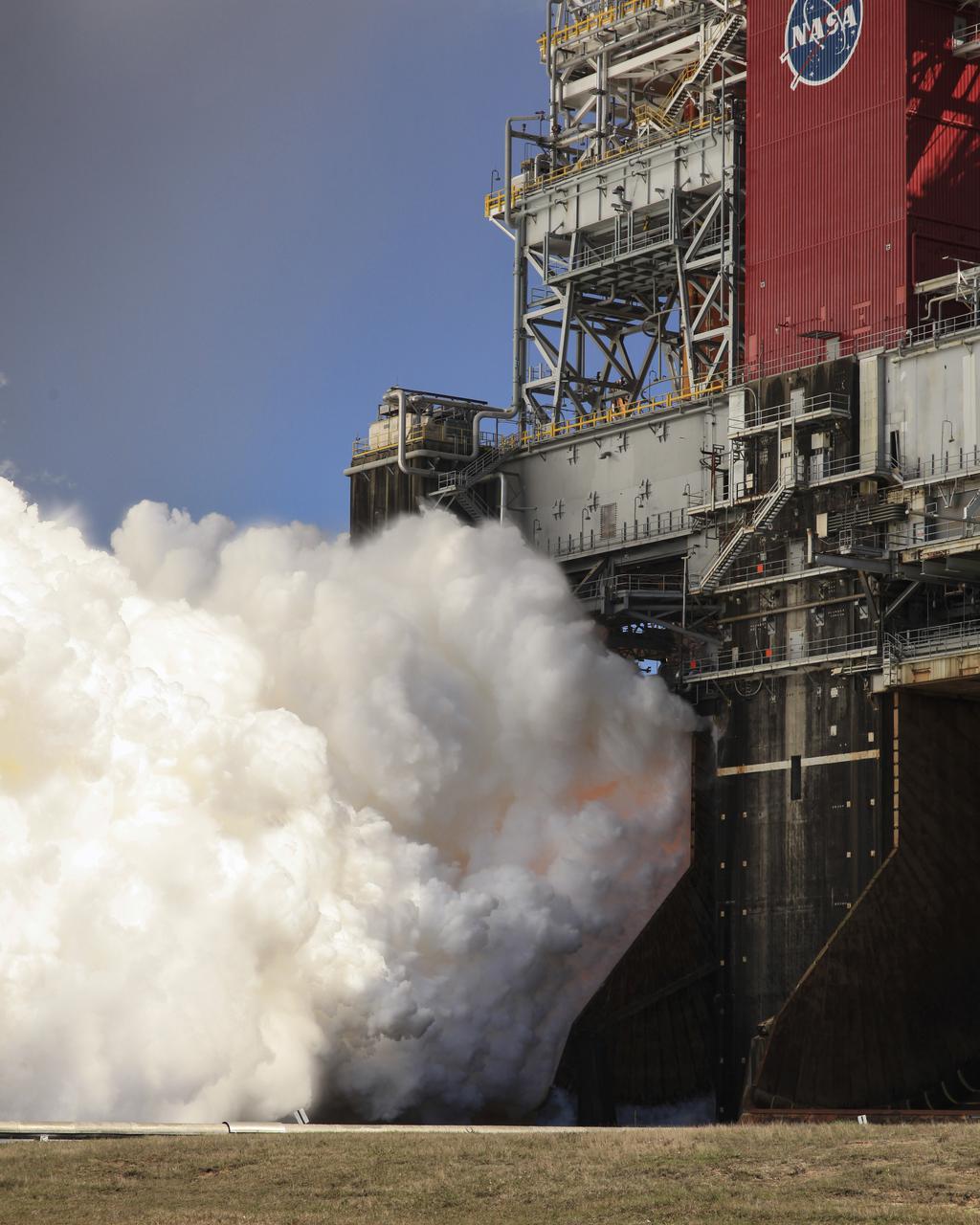 The core stage for the first flight of NASA’s Space Launch System rocket is seen in the B-2 Test Stand during a second hot fire test, Thursday, March 18, 2021, at NASA’s Stennis Space Center near Bay St. Louis, Mississippi. The four RS-25 engines fired for the full-duration of 8 minutes during the test and generated 1.6 million pounds of thrust. The hot fire test is the final stage of the Green Run test series, a comprehensive assessment of the Space Launch System’s core stage prior to launching the Artemis I mission to the Moon. Photo Credit: (NASA/Robert Markowitz)