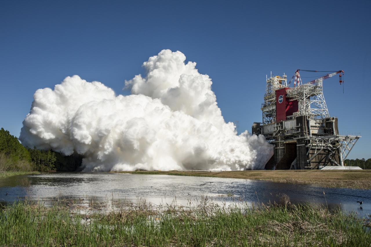The core stage for the first flight of NASA’s Space Launch System rocket is seen in the B-2 Test Stand during a second hot fire test, Thursday, March 18, 2021, at NASA’s Stennis Space Center near Bay St. Louis, Mississippi. The four RS-25 engines fired for the full-duration of 8 minutes during the test and generated 1.6 million pounds of thrust. The hot fire test is the final stage of the Green Run test series, a comprehensive assessment of the Space Launch System’s core stage prior to launching the Artemis I mission to the Moon. Photo Credit: (NASA/Robert Markowitz)