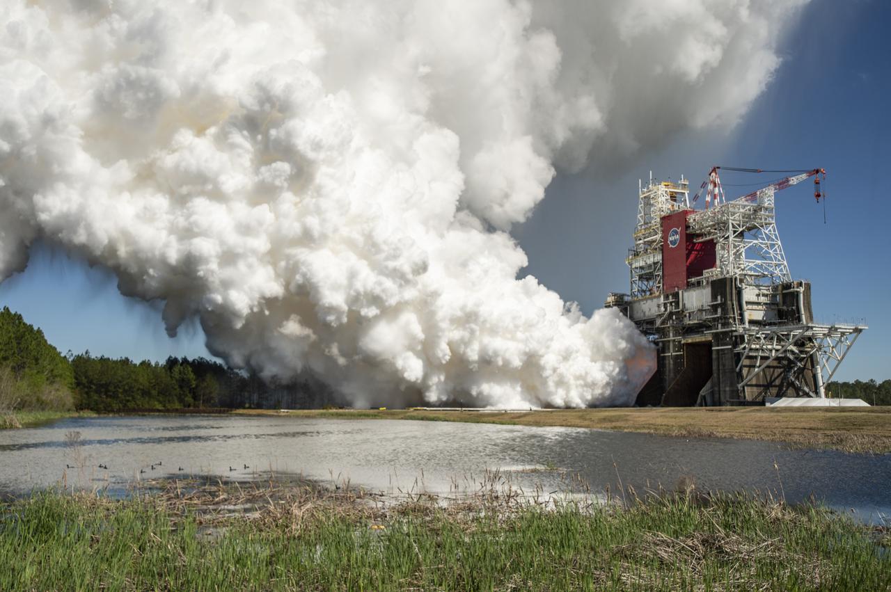 The core stage for the first flight of NASA’s Space Launch System rocket is seen in the B-2 Test Stand during a second hot fire test, Thursday, March 18, 2021, at NASA’s Stennis Space Center near Bay St. Louis, Mississippi. The four RS-25 engines fired for the full-duration of 8 minutes during the test and generated 1.6 million pounds of thrust. The hot fire test is the final stage of the Green Run test series, a comprehensive assessment of the Space Launch System’s core stage prior to launching the Artemis I mission to the Moon. Photo Credit: (NASA/Robert Markowitz)