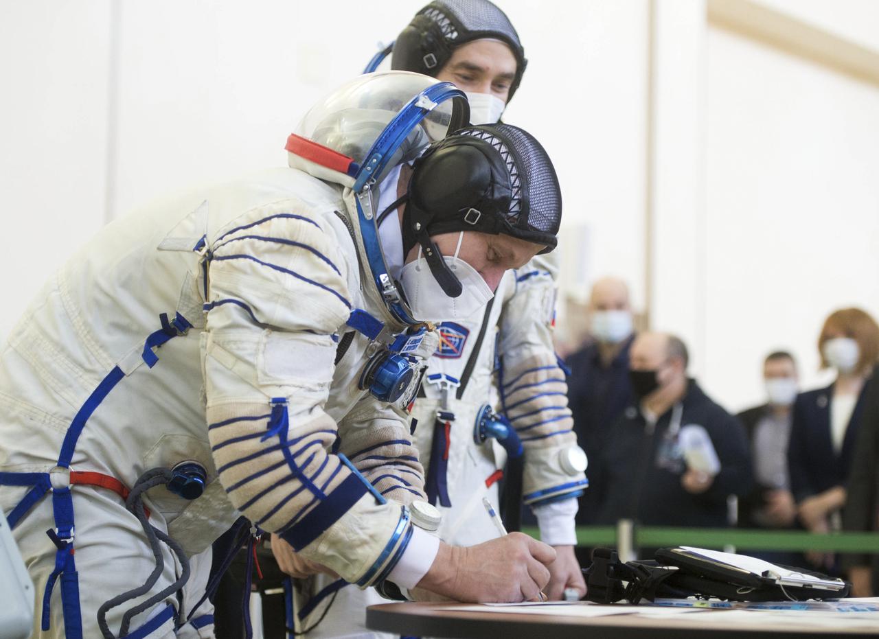 Expedition 65 crew member Oleg Novitskiy of Roscosmos, signs in for Soyuz qualification exams Saturday, March 20, 2021 at the Gagarin Cosmonaut Training Center (GCTC) in Star City, Russia, in advance of his scheduled launch April 9 from Baikonur Cosmodrome in Kazakhstan to the International Space Station. Photo Credit: (NASA/GCTC/Andrey Shelepin)