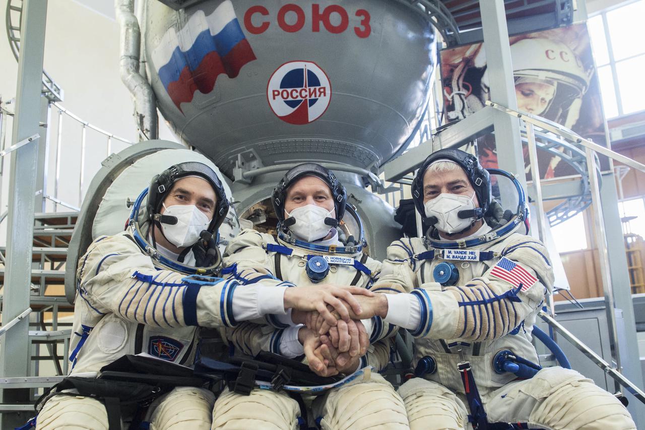 Expedition 65 crew members Russian cosmonaut Pyotr Dubrov of Roscosmos, left, Russian cosmonaut Oleg Novitskiy of Roscosmos, center, and NASA astronaut Mark Vande Hei, pose for a photo during qualification exams, Saturday, March 20, 2021 at the Gagarin Cosmonaut Training Center (GCTC) in Star City, Russia, in advance of their scheduled launch April 9 from Baikonur Cosmodrome in Kazakhstan to the International Space Station. Photo Credit: (NASA/GCTC/Andrey Shelepin)