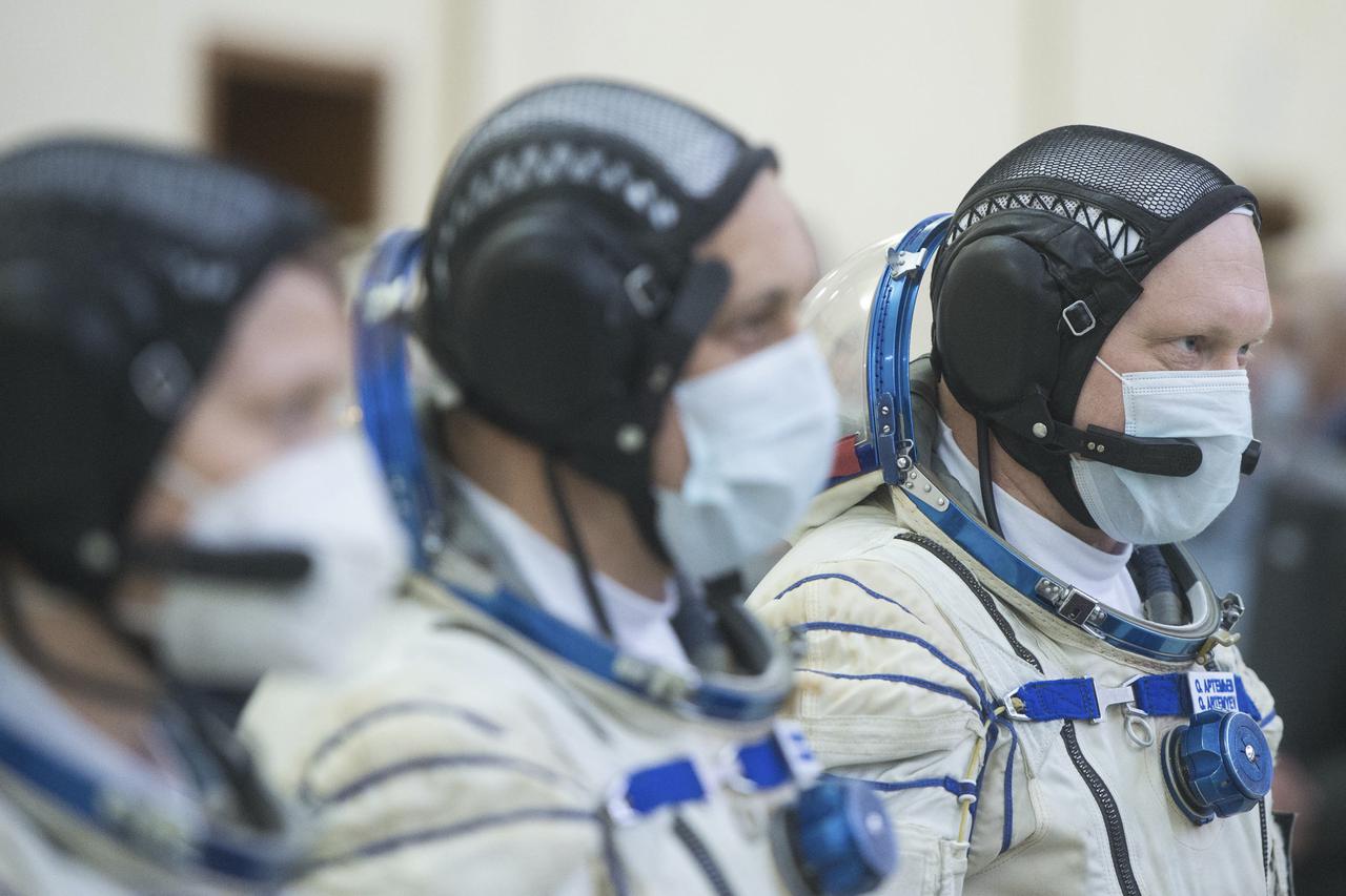 Expedition 65 backup crew member Oleg Artemyev of Roscosmos is seen with crew mates NASA astronaut Anne McClain, left, and Anton Shkaplerov of Roscosmos during Soyuz qualification exams Monday, March 22, 2021, at the Gagarin Cosmonaut Training Center (GCTC) in Star City, Russia, in advance of the Expedition 65 launch April 9 from Baikonur Cosmodrome in Kazakhstan to the International Space Station. Photo Credit: (NASA/GCTC/Andrey Shelepin)