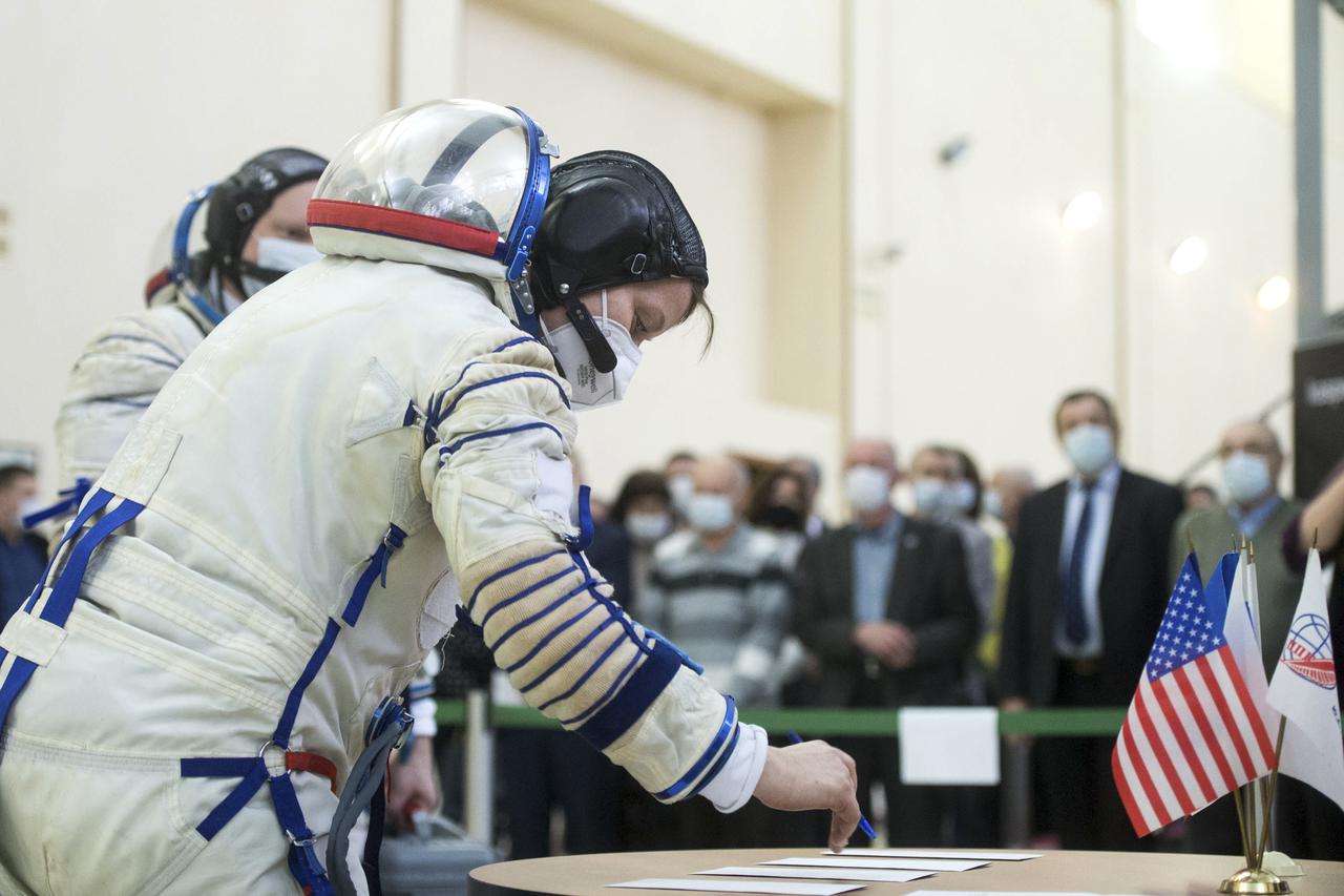 Expedition 65 backup crew member, Anne McClain of NASA signs in for Soyuz qualification exams Monday, March 22, 2021, at the Gagarin Cosmonaut Training Center (GCTC) in Star City, Russia, in advance of the Expedition 65 launch April 9 from Baikonur Cosmodrome in Kazakhstan to the International Space Station. Photo Credit: (NASA/GCTC/Andrey Shelepin)