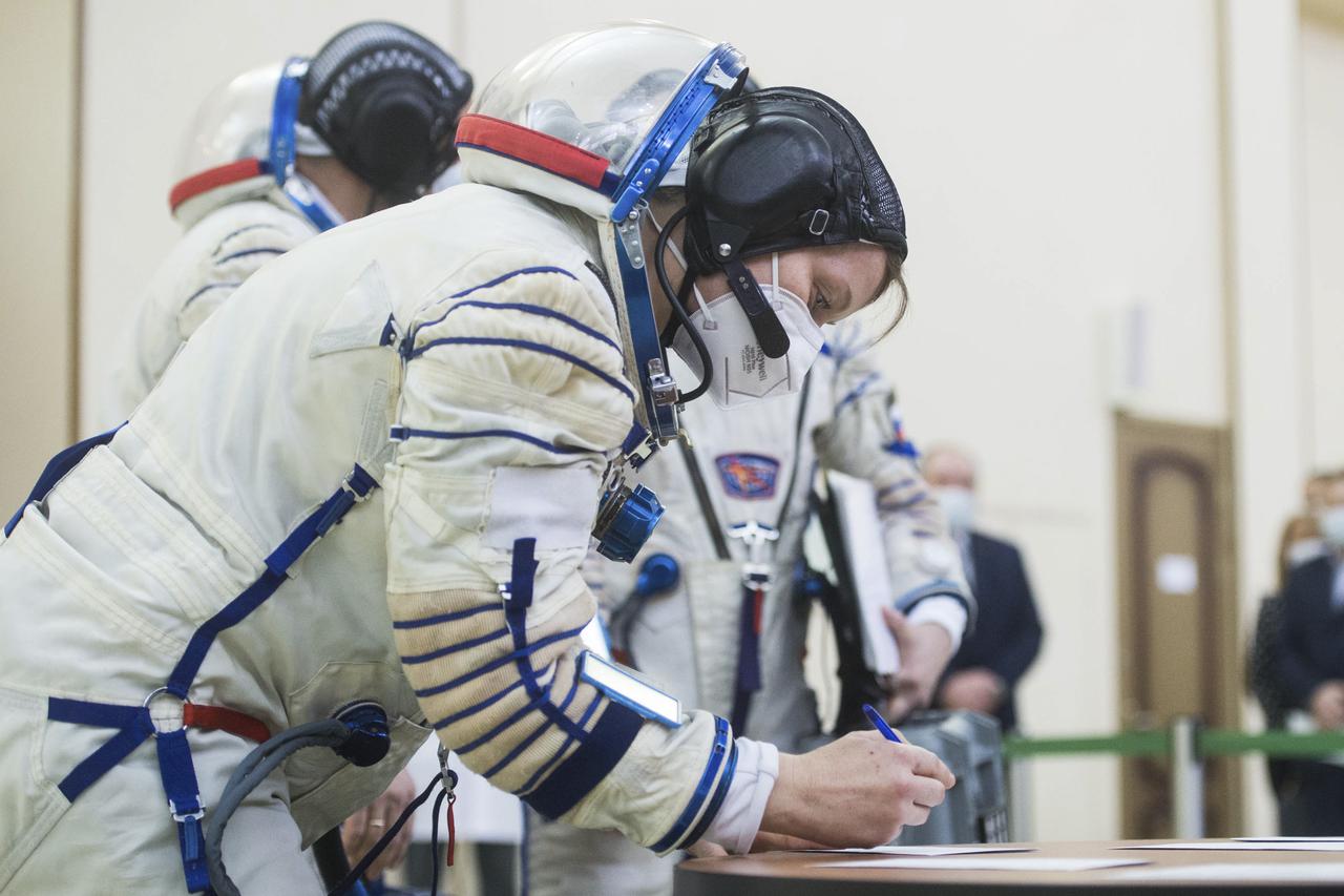 Expedition 65 backup crew member, Anne McClain of NASA signs in for Soyuz qualification exams Monday, March 22, 2021, at the Gagarin Cosmonaut Training Center (GCTC) in Star City, Russia, in advance of the Expedition 65 launch April 9 from Baikonur Cosmodrome in Kazakhstan to the International Space Station. Photo Credit: (NASA/GCTC/Andrey Shelepin)