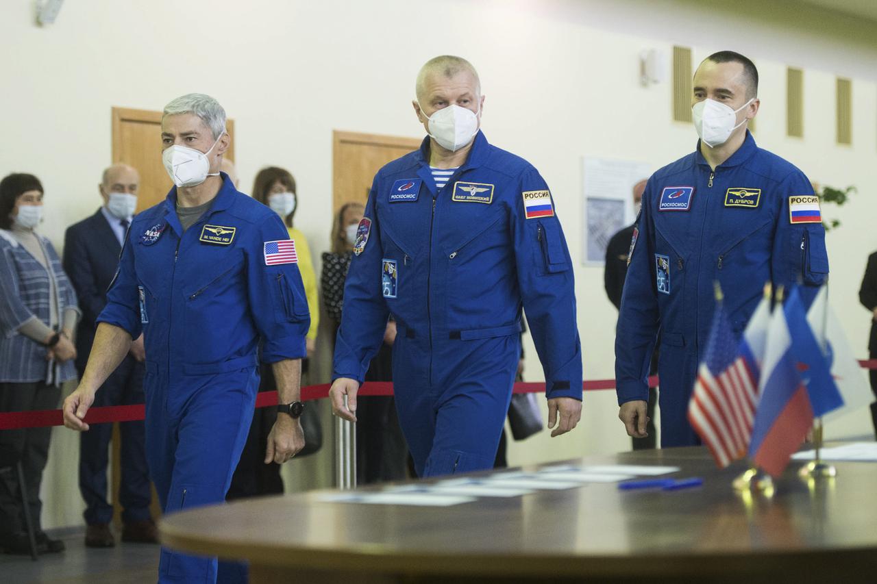 Expedition 65 crew members NASA astronaut Mark Vande Hei, left, Russian cosmonaut Oleg Novitskiy of Roscosmos, center, and Russian cosmonaut Pyotr Dubrov of Roscosmos arrive for Soyuz qualification exams Monday, March 22, 2021, at the Gagarin Cosmonaut Training Center (GCTC) in Star City, Russia, in advance of their scheduled launch April 9 from Baikonur Cosmodrome in Kazakhstan to the International Space Station. Photo Credit: (NASA/GCTC/Andrey Shelepin)