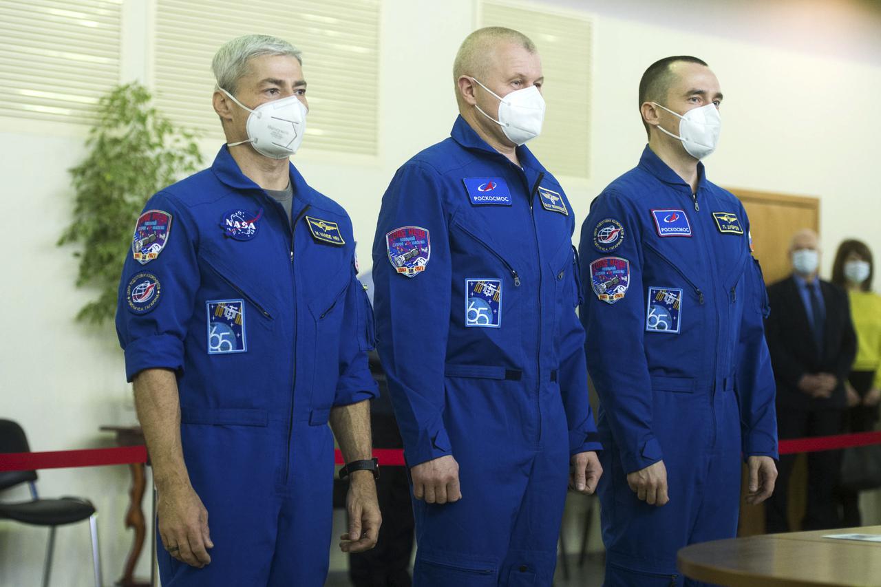 Expedition 65 crew members NASA astronaut Mark Vande Hei, left, Russian cosmonaut Oleg Novitskiy of Roscosmos, center, and Russian cosmonaut Pyotr Dubrov of Roscosmos arrive for Soyuz qualification exams Monday, March 22, 2021, at the Gagarin Cosmonaut Training Center (GCTC) in Star City, Russia, in advance of their scheduled launch April 9 from Baikonur Cosmodrome in Kazakhstan to the International Space Station. Photo Credit: (NASA/GCTC/Andrey Shelepin)