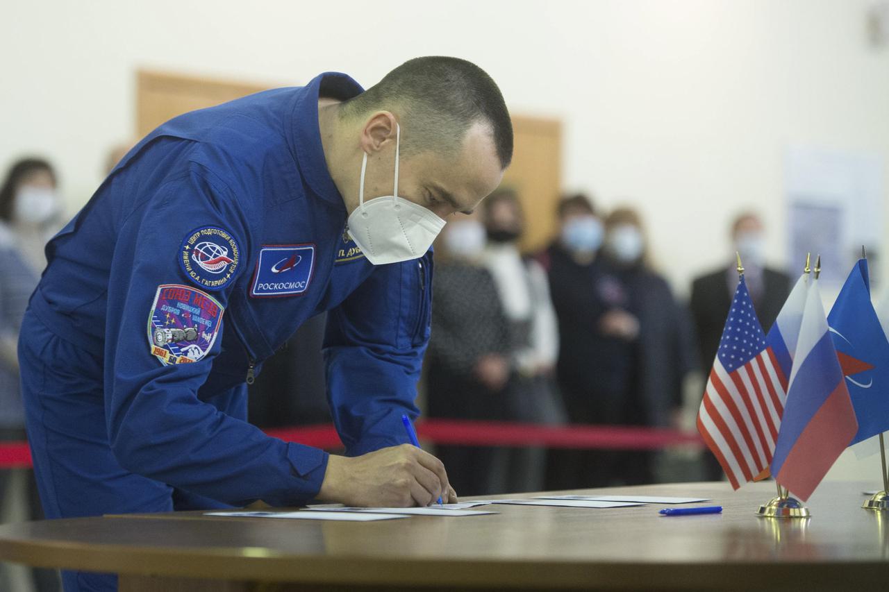 Expedition 65 crew member Pyotr Dubrov of Roscosmos, signs in for Soyuz qualification exams Monday, March 22, 2021, at the Gagarin Cosmonaut Training Center (GCTC) in Star City, Russia, in advance of his scheduled launch April 9 from Baikonur Cosmodrome in Kazakhstan to the International Space Station. Photo Credit: (NASA/GCTC/Andrey Shelepin)