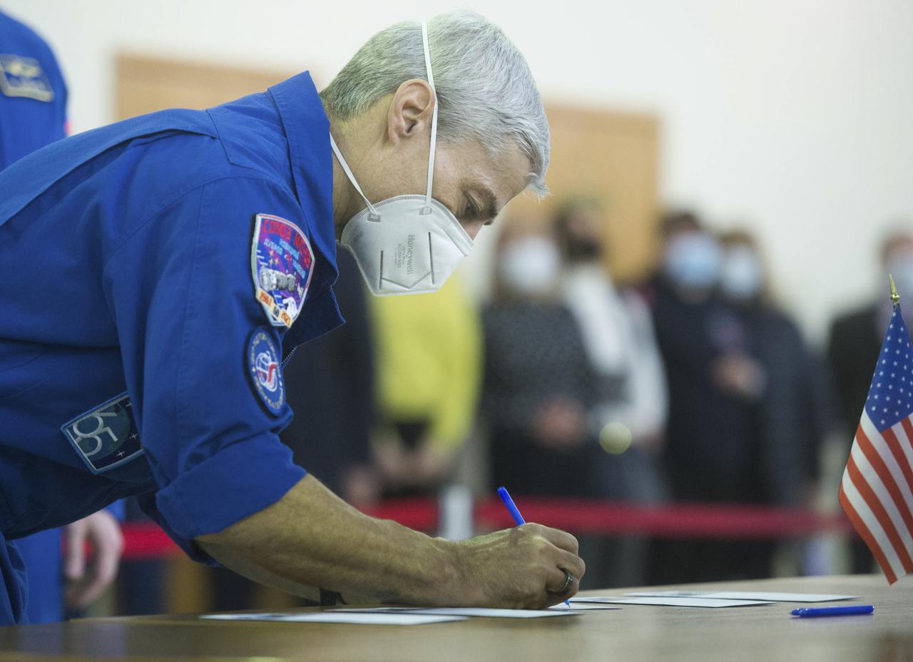 Expedition 65 crew member Mark Vande Hei of NASA, signs in for Soyuz qualification exams Monday, March 22, 2021, at the Gagarin Cosmonaut Training Center (GCTC) in Star City, Russia, in advance of his scheduled launch April 9 from Baikonur Cosmodrome in Kazakhstan to the International Space Station. Photo Credit: (NASA/GCTC/Andrey Shelepin)