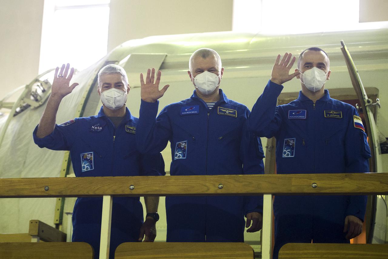 Expedition 65 crew members NASA astronaut Mark Vande Hei, left, Russian cosmonaut Oleg Novitskiy of Roscosmos, center, and Russian cosmonaut Pyotr Dubrov of Roscosmos wave during Soyuz qualification exams Monday, March 22, 2021, at the Gagarin Cosmonaut Training Center (GCTC) in Star City, Russia, in advance of their scheduled launch April 9 from Baikonur Cosmodrome in Kazakhstan to the International Space Station. Photo Credit: (NASA/GCTC/Andrey Shelepin)