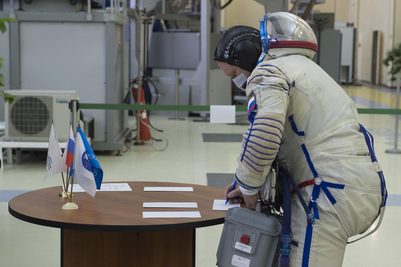 Expedition 65 backup crew member, Oleg Artemyev of Roscosmos signs in for Soyuz qualification exams Monday, March 22, 2021 at the Gagarin Cosmonaut Training Center (GCTC) in Star City, Russia, in advance of the Expedition 65 launch April 9 from Baikonur Cosmodrome in Kazakhstan to the International Space Station. Photo Credit: (GCTC/Andrey Shelepin)