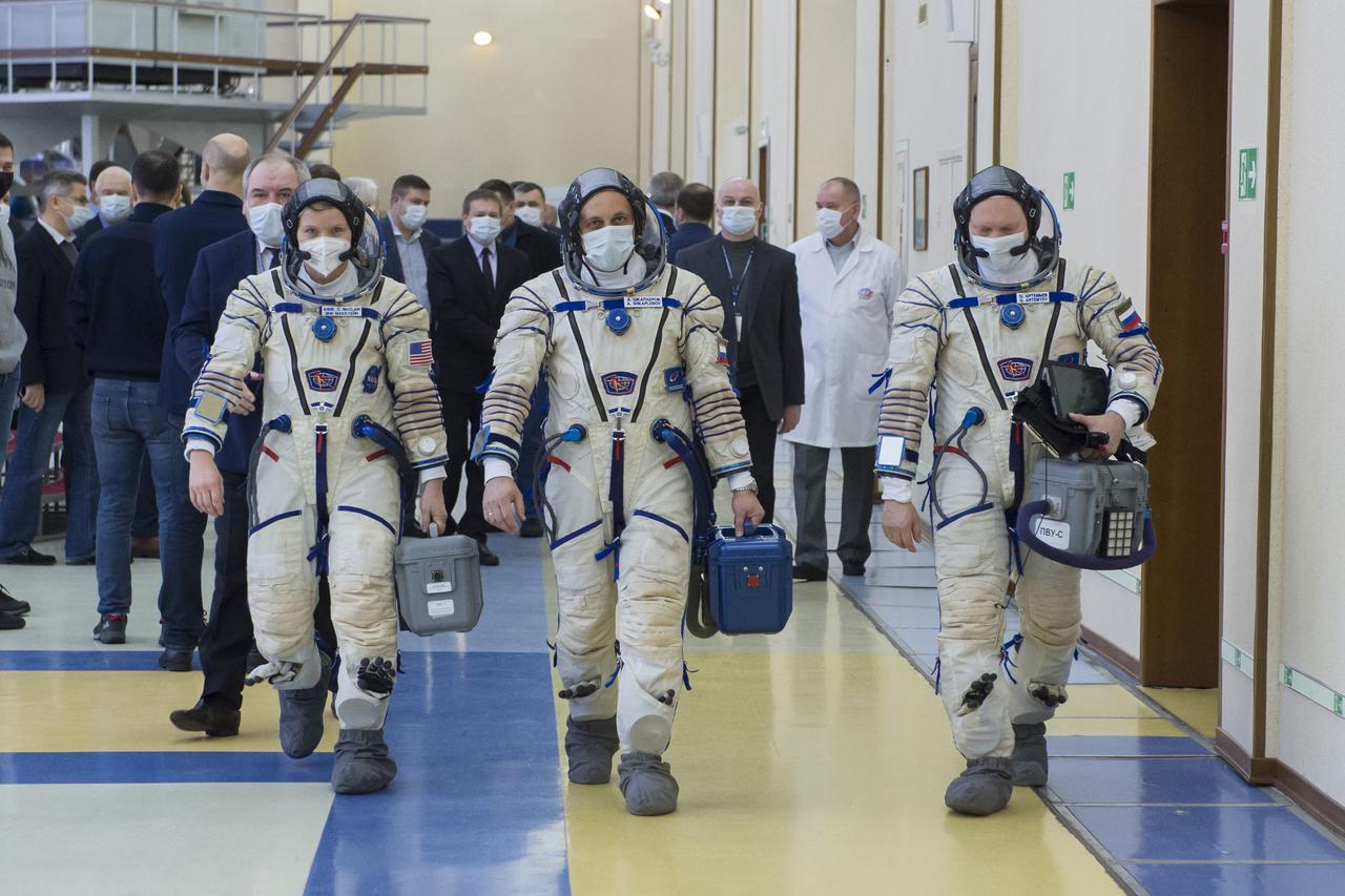 Expedition 65 backup crew members NASA astronaut Anne McClain, left, Russian cosmonaut Anton Shkaplerov of Roscosmos, center, and Russian cosmonaut Oleg Artemyev of Roscosmos arrive for Soyuz qualification exams Monday, March 22, 2021 at the Gagarin Cosmonaut Training Center (GCTC) in Star City, Russia, in advance of the Expedition 65 launch April 9 from Baikonur Cosmodrome in Kazakhstan to the International Space Station. Photo Credit: (NASA/GCTC/Irina Spector)