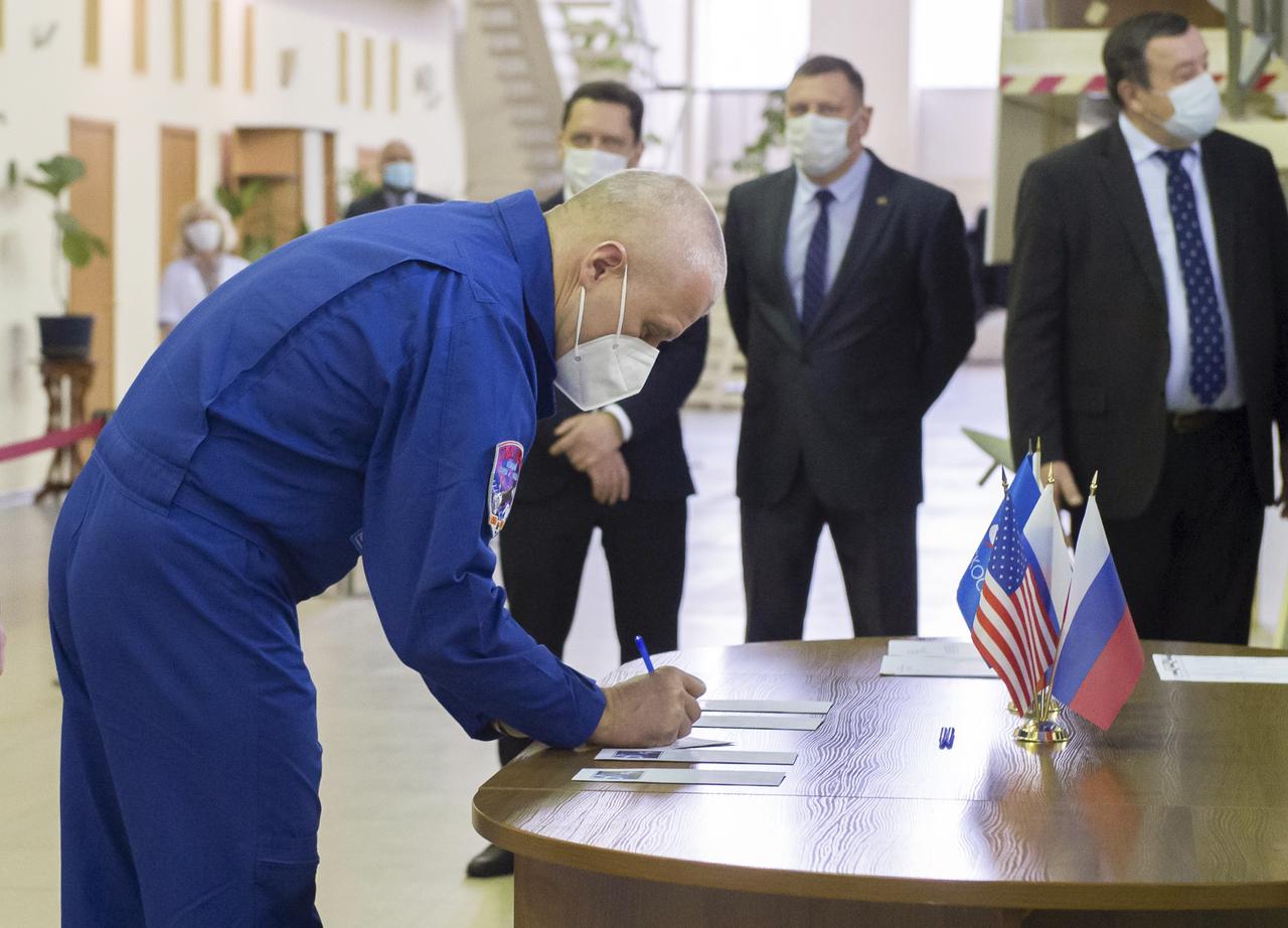 Expedition 65 crew member Russian cosmonaut Oleg Novitskiy of Roscosmos, signs in for Soyuz qualification exams Monday, March 22, 2021 at the Gagarin Cosmonaut Training Center (GCTC) in Star City, Russia, in advance of his scheduled launch April 9 from Baikonur Cosmodrome in Kazakhstan to the International Space Station. Photo Credit: (NASA/GCTC/Irina Spector)