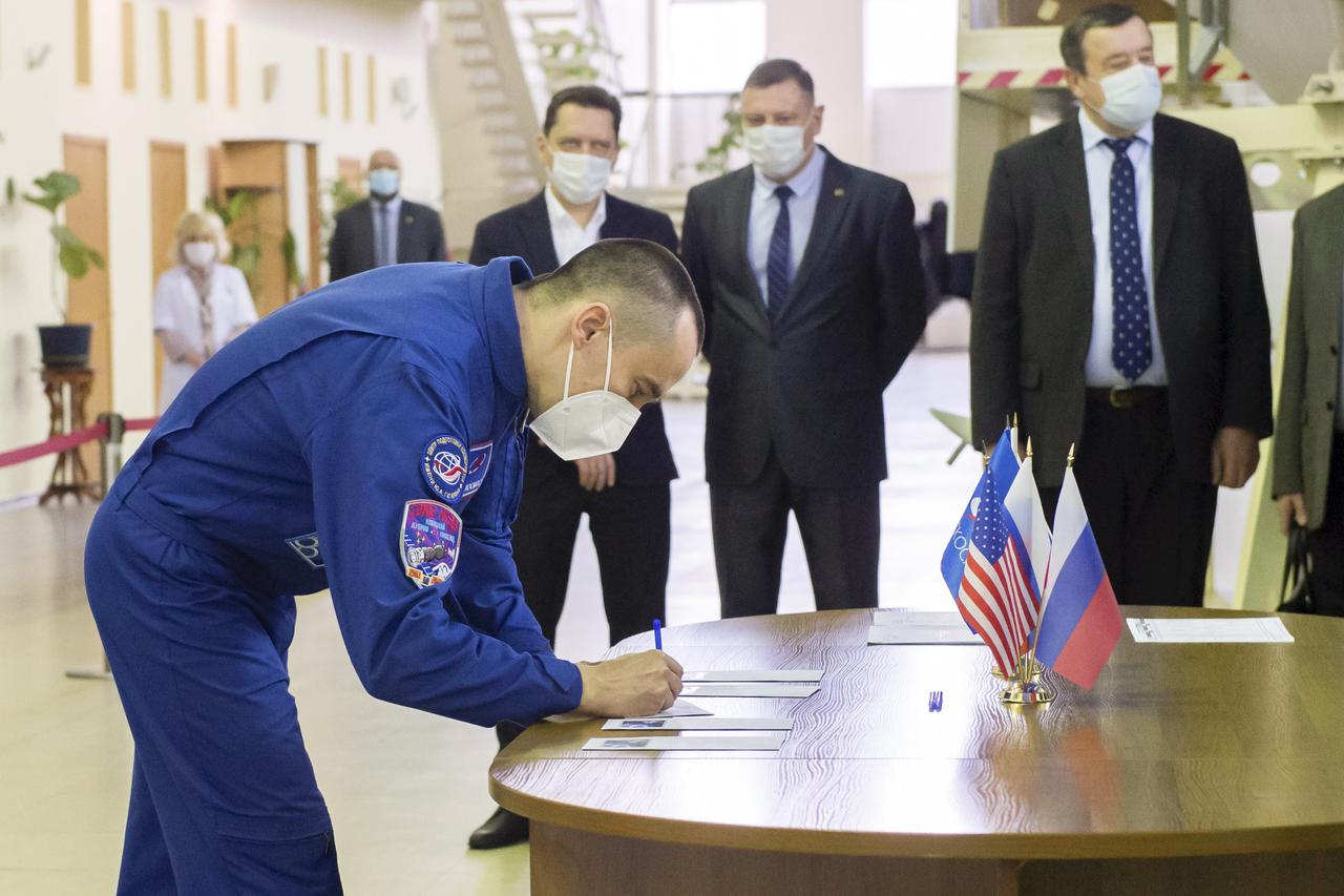 Expedition 65 crew member Russian cosmonaut Pyotr Dubrov of Roscosmos, signs in for Soyuz qualification exams Monday, March 22, 2021 at the Gagarin Cosmonaut Training Center (GCTC) in Star City, Russia, in advance of his scheduled launch April 9 from Baikonur Cosmodrome in Kazakhstan to the International Space Station. Photo Credit: (NASA/GCTC/Irina Spector)
