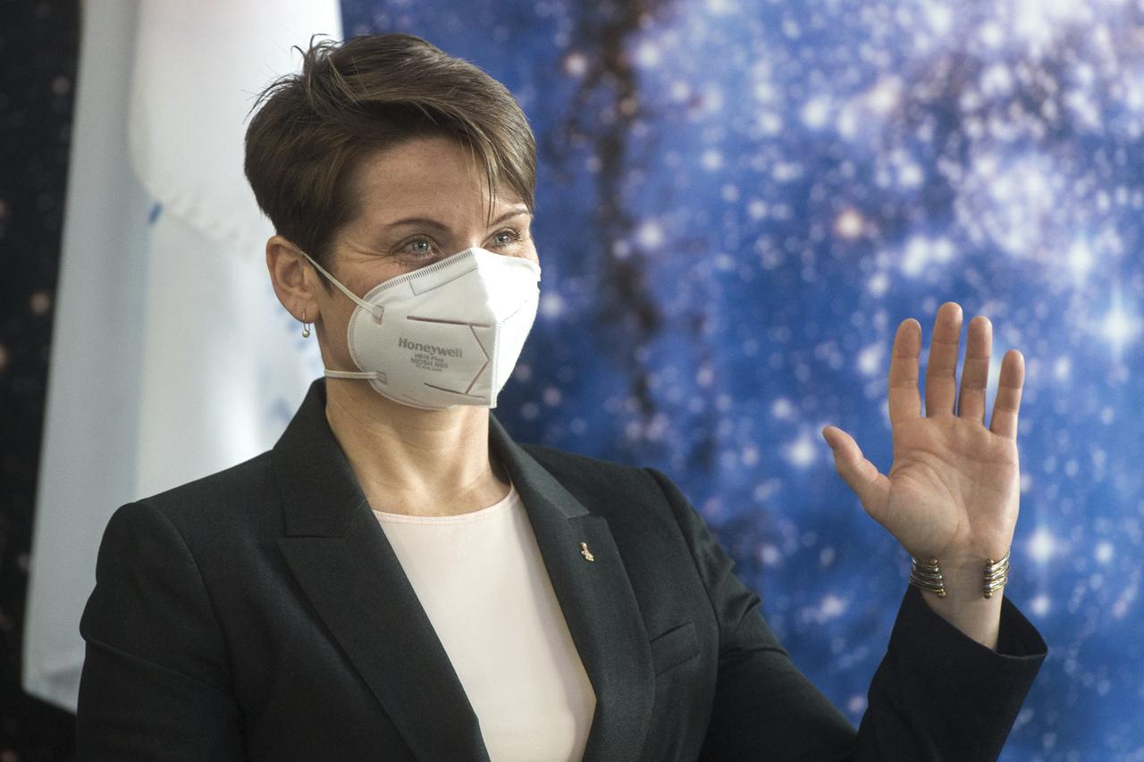 Expedition 65 backup crew member NASA astronaut Anne McClain waves during a press conference prior to the prime crew’s launch from the Baikonur Cosmodrome in Kazakhstan, Wednesday, March 24, 2021 at the Gagarin Cosmonaut Training Center (GCTC) in Star City, Russia. Photo Credit: (NASA/GCTC/Andrey Shelepin)
