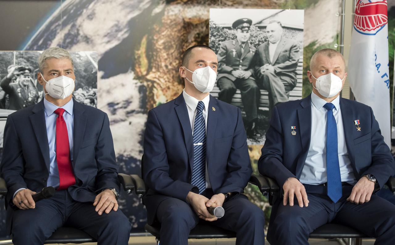 Expedition 65 crew members NASA astronaut Mark Vande Hei, left, Russian cosmonaut Pyotr Dubrov of Roscosmos, center, and Russian cosmonaut Oleg Novitskiy of Roscosmos, listen during a press conference prior to their launch from the Baikonur Cosmodrome, Wednesday, March 24, 2021 at the Gagarin Cosmonaut Training Center (GCTC) in Star City, Russia. Photo Credit: (NASA/GCTC/Irina Spector)