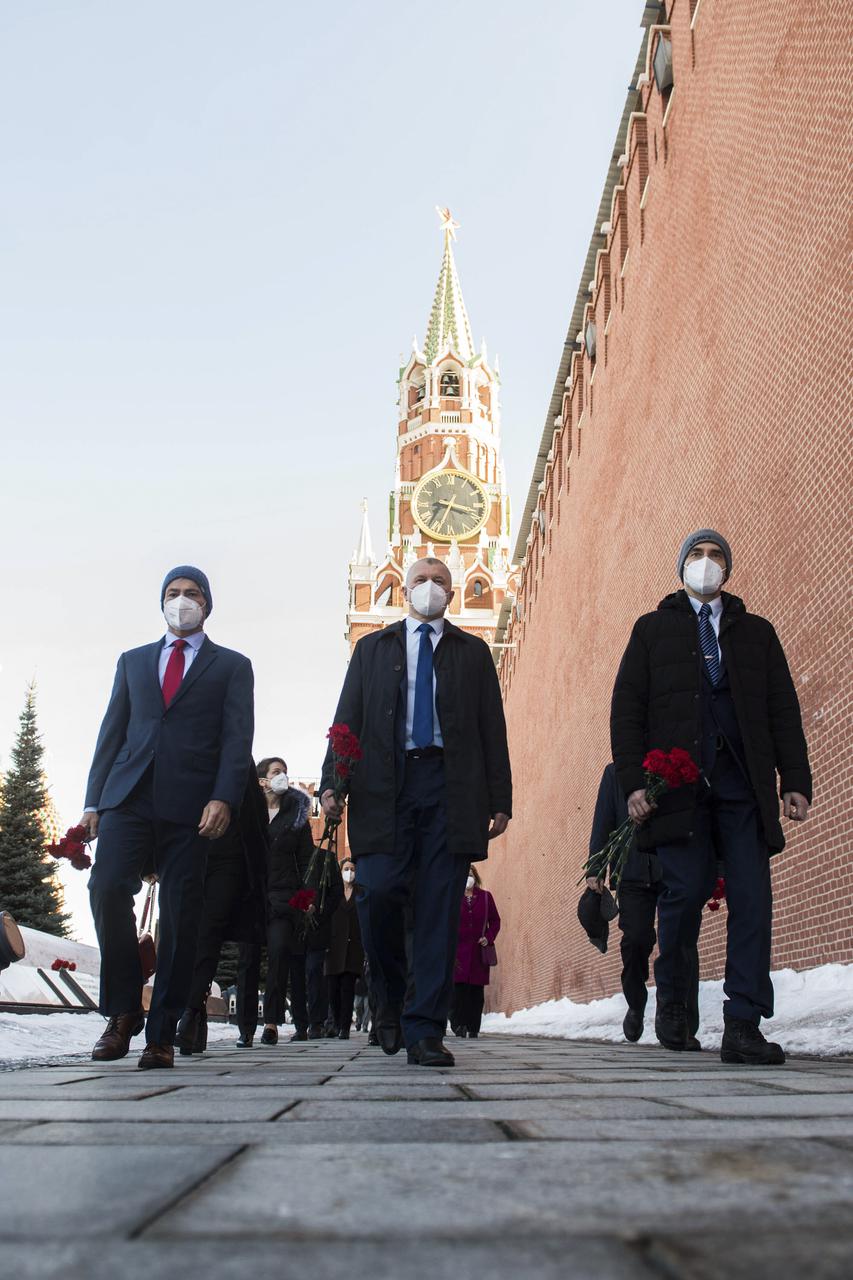Expedition 65 prime crew members, NASA astronaut Mark Vande Hei, left, Russian cosmonaut Oleg Novitskiy of Roscosmos, center, and Russian cosmonaut Pyotr Dubrov of Roscosmos visit Red Square to lay flowers at the site where Russian space icons are interred as part of traditional pre-launch ceremonies, Wednesday, March 24, 2021 in Moscow. Photo Credit: (NASA/GCTC/Andrey Shelepin)