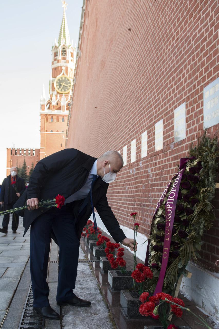 Expedition 65 prime crew member Russian cosmonaut Oleg Novitskiy of Roscosmos lays flowers at the site where Russian space icons are interred as part of traditional pre-launch ceremonies, Wednesday, March 24, 2021, at Red Square in Moscow. Photo Credit: (NASA/GCTC/Andrey Shelepin)