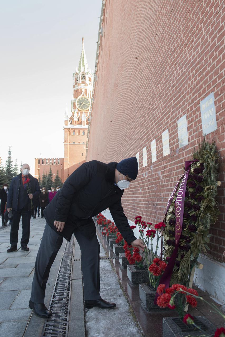 Expedition 65 backup crew member Russian cosmonaut Anton Shkaplerov of Roscosmos lays flowers at the site where Russian space icons are interred as part of traditional pre-launch ceremonies, Wednesday, March 24, 2021, at Red Square in Moscow. Photo Credit: (NASA/GCTC/Andrey Shelepin)
