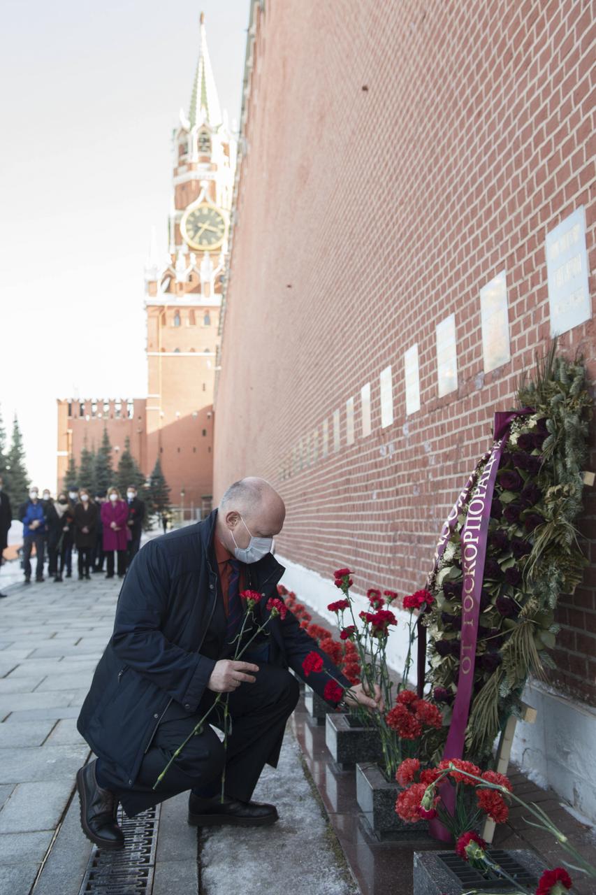 Expedition 65 backup crew member Russian cosmonaut Oleg Artemyev of Roscosmos lays flowers at the site where Russian space icons are interred as part of traditional pre-launch ceremonies, Wednesday, March 24, 2021, at Red Square in Moscow. Photo Credit: (NASA/GCTC/Andrey Shelepin)