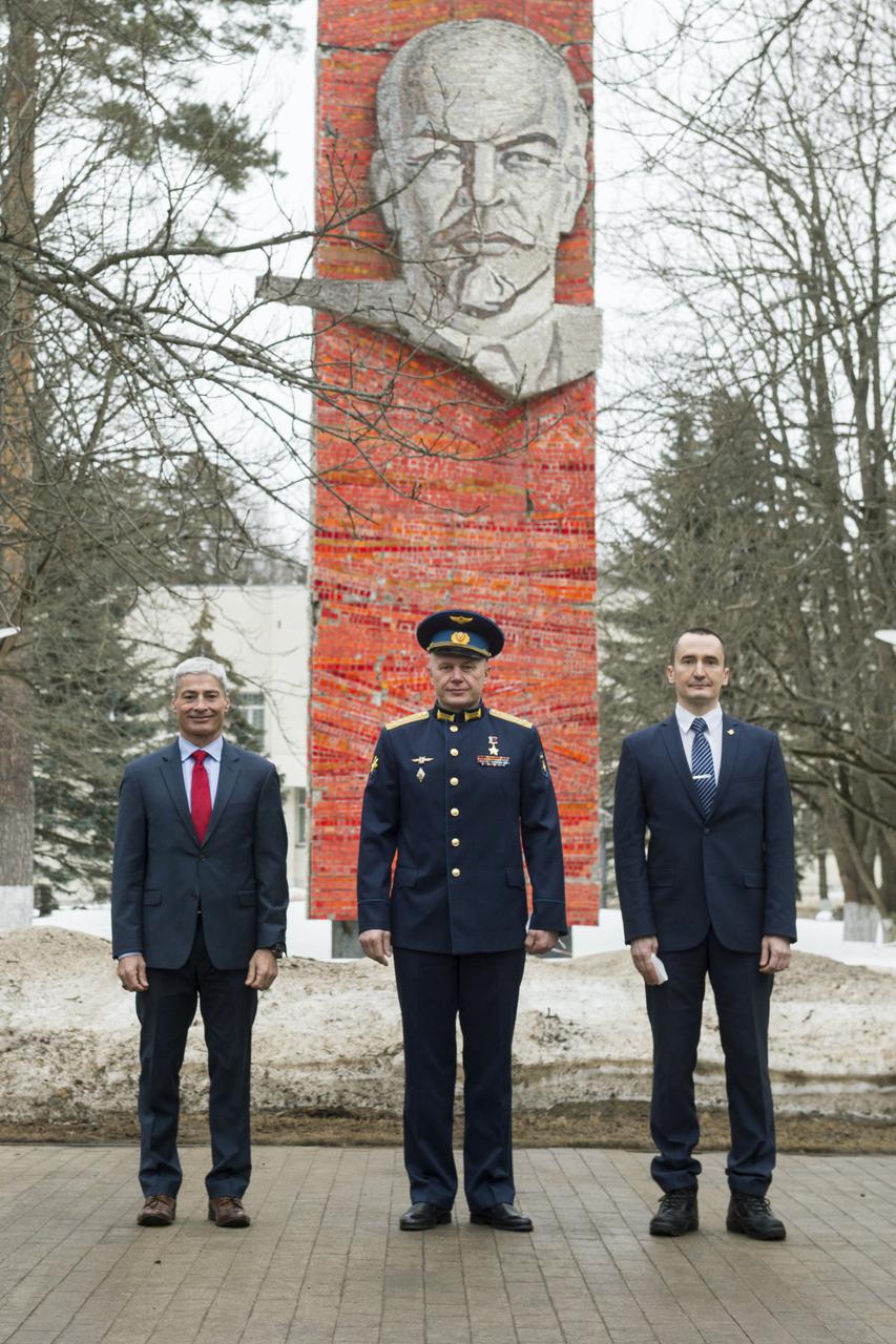 Expedition 65 prime crew members, NASA astronaut Mark Vande Hei, left, Russian cosmonaut Oleg Novitskiy of Roscosmos, center, and Russian cosmonaut Pyotr Dubrov of Roscosmos, right, pose for a photo during an official farewell ceremony prior to their departure to Baikonur for launch from the Baikonur Cosmodrome, Friday, March 26, 2021, at the Gagarin Cosmonaut Training Center (GCTC) in Star City, Russia. Photo Credit: (NASA/GCTC/Andrey Shelepin)
