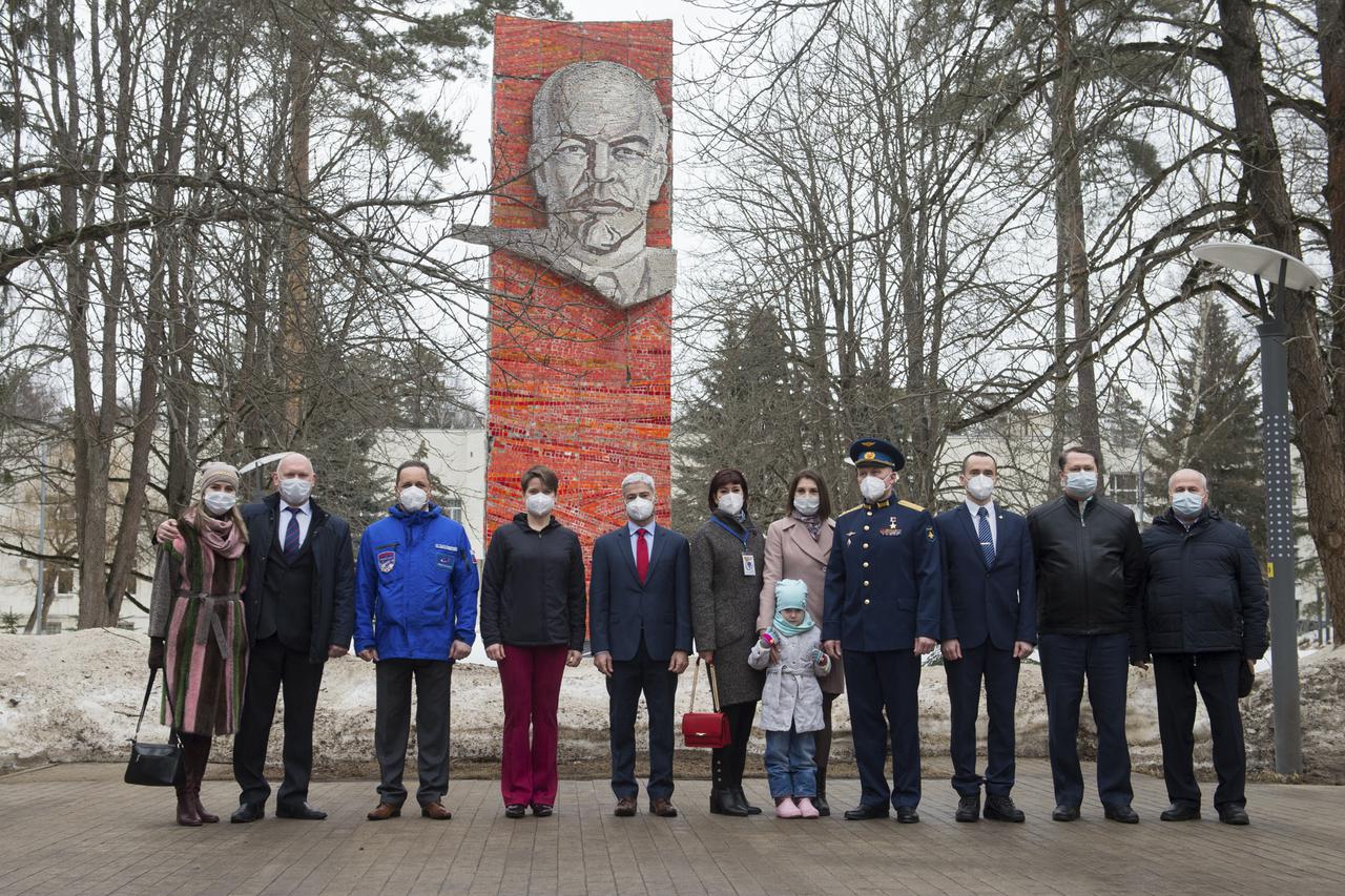 Friends and family join in for a photo with Expedition 65 backup crew members, Russian cosmonaut Oleg Artemyev of Roscosmos, second from left, Russian cosmonaut Anton Shkaplerov of Roscosmos, third from left, NASA astronaut Anne McClain, fourth from left, and Expedition 65 prime crew members, NASA astronaut Mark Vande Hei, fifth from left, Russian cosmonaut Oleg Novitskiy of Roscosmos, fourth from right, and Russian cosmonaut Pyotr Dubrov of Roscosmos, third from right, during an official farewell ceremony prior to their departure to Baikonur for the prime crew’s launch from the Baikonur Cosmodrome, Friday, March 26, 2021 at the Gagarin Cosmonaut Training Center (GCTC) in Star City, Russia. Photo Credit: (NASA/GCTC/Andrey Shelepin)