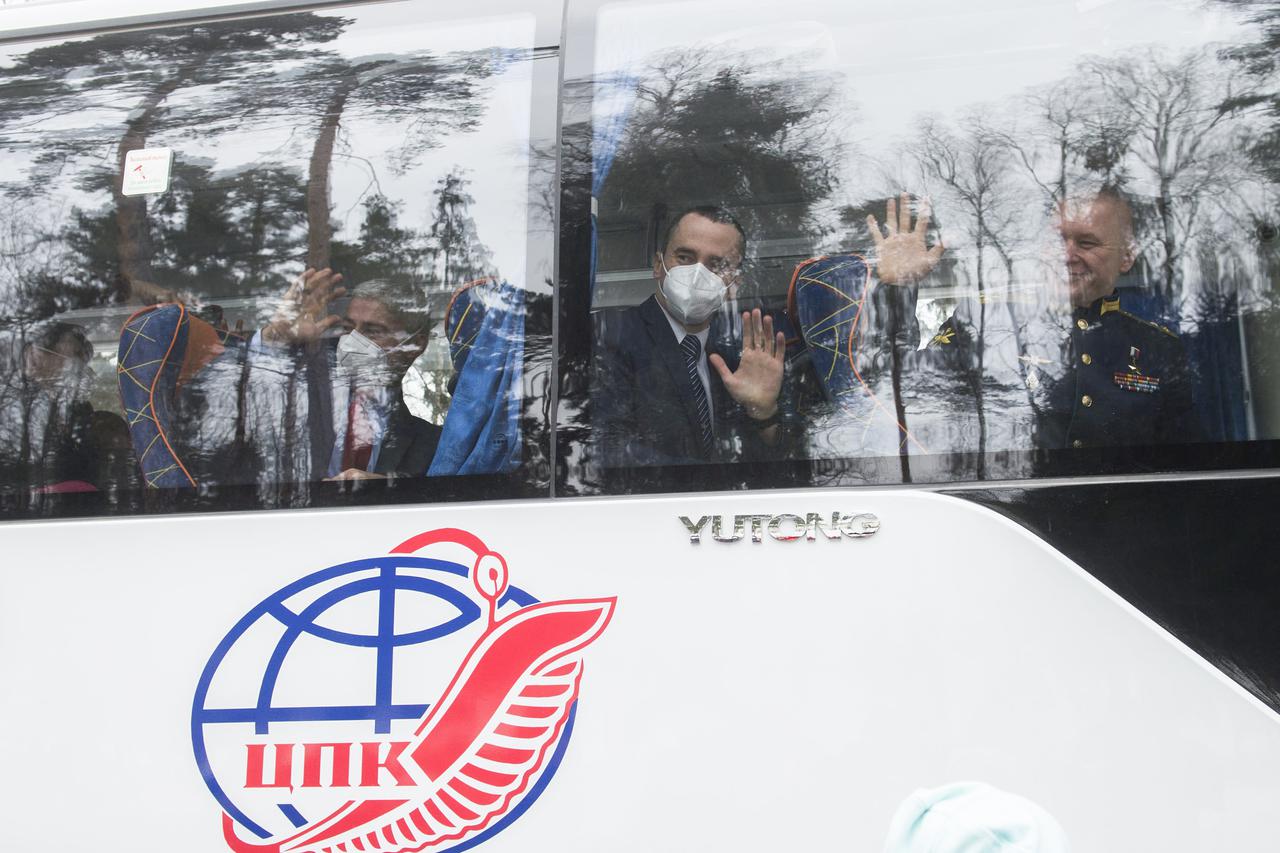 From left to right, Expedition 65 prime crew members, NASA astronaut Mark Vande Hei, Russian cosmonaut Pyotr Dubrov of Roscosmos, and Russian cosmonaut Oleg Novitskiy of Roscosmos, wave goodbye after boarding the bus to their flight to Baikonur for launch from the Baikonur Cosmodrome, Friday, March 26, 2021 at the Gagarin Cosmonaut Training Center (GCTC) in Star City, Russia. Photo Credit: (NASA/GCTC/Andrey Shelepin)