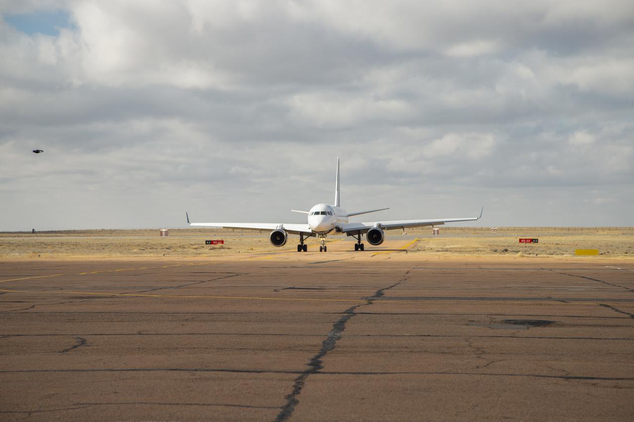 The airplane carrying Expedition 65 prime crew members, NASA astronaut Mark Vande Hei, Russian cosmonauts Oleg Novitskiy of Roscosmos, and Pyotr Dubrov of Roscosmos, and Expedition 65 backup crew members, NASA astronaut Anne McClain, and Russian cosmonauts Anton Shkaplerov of Roscosmos, and Oleg Artemyev of Roscosmos,arrives in Baikonur, Kazakhstan from the Gagarin Cosmonaut Training Center (GCTC), Friday, March 26, 2021. The prime crew is scheduled to launch from the Baikonur Cosmodrome on a Soyuz rocket April 9. Photo Credit: (NASA/GCTC/Irina Spector)