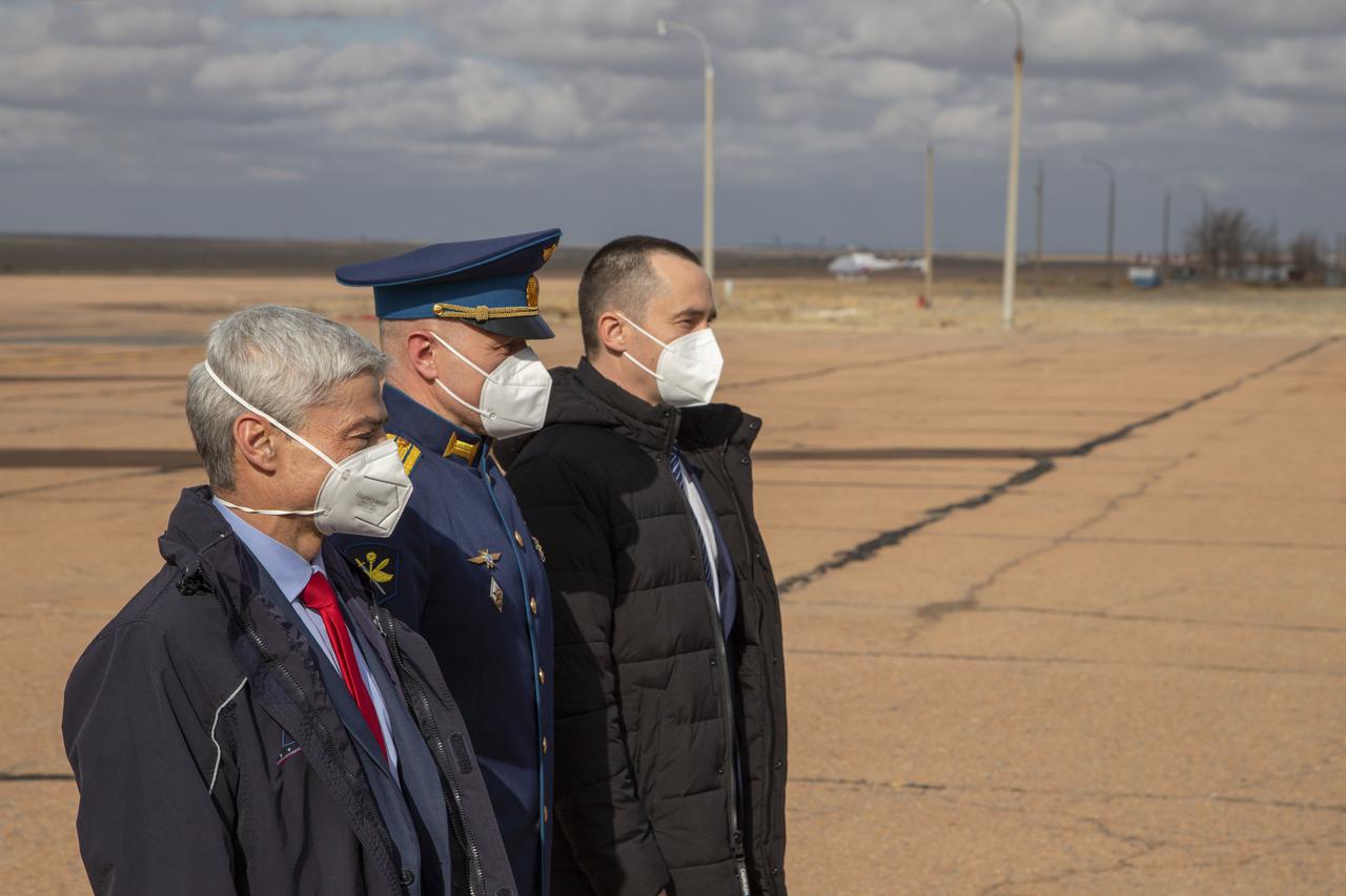 Expedition 65 prime crew members, NASA astronaut Mark Vande Hei, left, and Russian cosmonauts Oleg Novitskiy of Roscosmos, center, and Pyotr Dubrov of Roscosmos, right, meet with mission managers after arriving in Baikonur, Kazakhstan from the Gagarin Cosmonaut Training Center (GCTC), Friday, March 26, 2021. They are scheduled to launch from the Baikonur Cosmodrome on a Soyuz rocket April 9. Photo Credit: (NASA/GCTC/Irina Spector)
