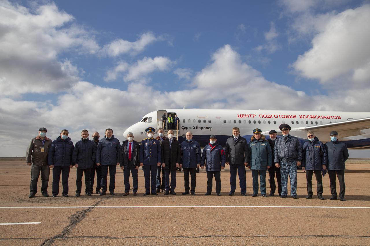 Expedition 65 prime crew members, NASA astronaut Mark Vande Hei, and Russian cosmonauts Oleg Novitskiy of Roscosmos, and Pyotr Dubrov of Roscosmos, pose for a photo with Roscosmos mission managers after arriving in Baikonur, Kazakhstan from the Gagarin Cosmonaut Training Center (GCTC), Friday, March 26, 2021. They are scheduled to launch from the Baikonur Cosmodrome on a Soyuz rocket April 9. Photo Credit: (NASA/GCTC/Irina Spector)