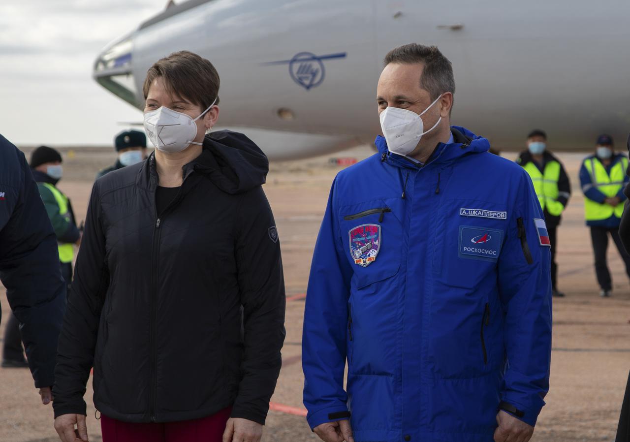 Expedition 65 backup crew members NASA astronaut Anne McClain, left, and Russian cosmonaut Anton Shkaplerov of Roscosmos, are seen after arriving in Baikonur, Kazakhstan from the Gagarin Cosmonaut Training Center (GCTC), Friday, March 26, 2021. The prime crew is scheduled to launch from the Baikonur Cosmodrome on a Soyuz rocket April 9. Photo Credit: (NASA/GCTC/Irina Spector)