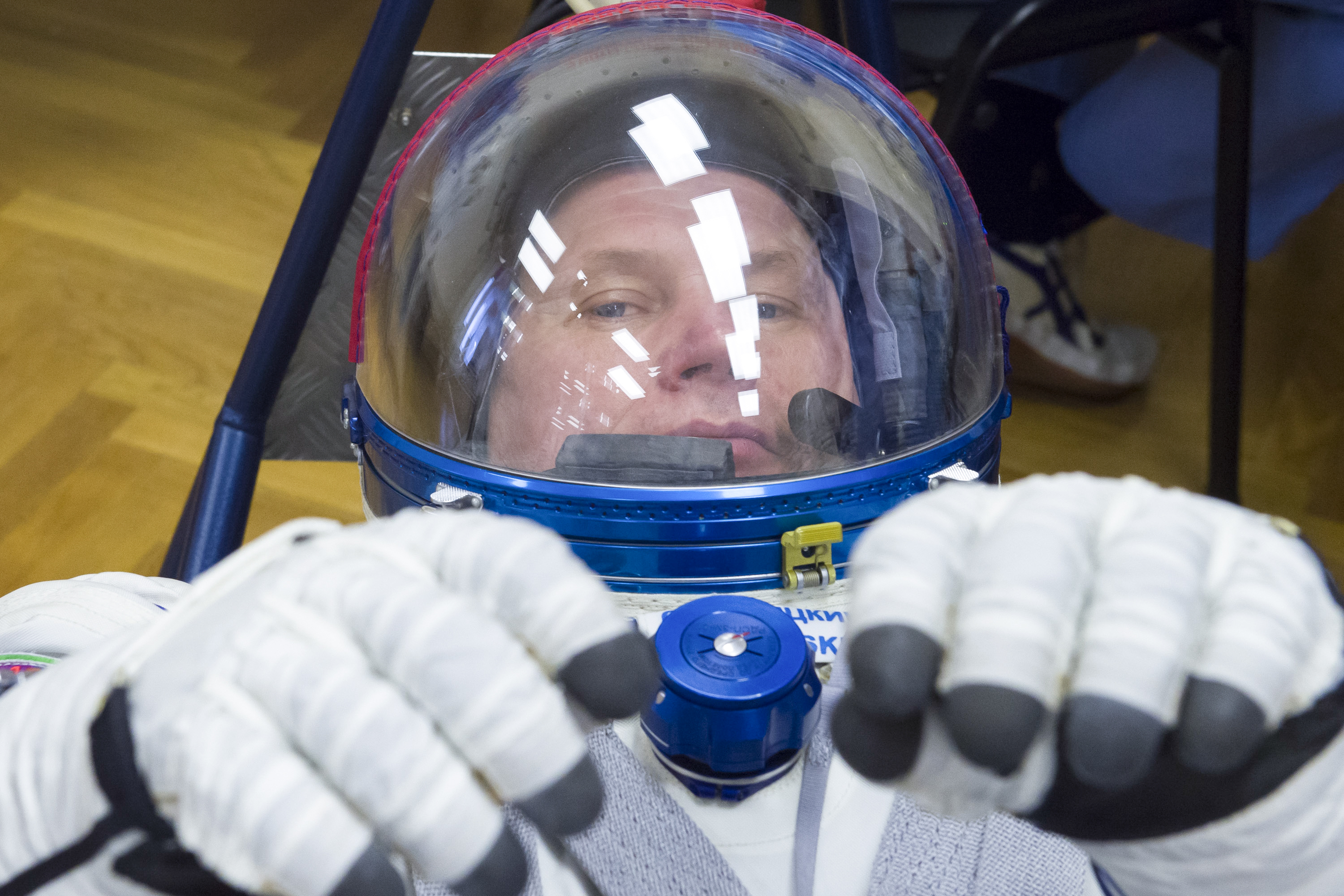 Expedition 65 prime crew member Oleg Novitskiy of Roscosmos has his Sokol suit pressure checked during a fit check to prepare for launch with crew mates Russian cosmonaut Pyotr Dubrov of Roscosmos and NASA astronaut Mark Vande Hei, Saturday, March 27, 2021 at the Baikonur Cosmodrome in Kazakhstan. They are scheduled to launch on a Soyuz rocket April 9. Photo Credit: (NASA/GCTC/Irina Spector)