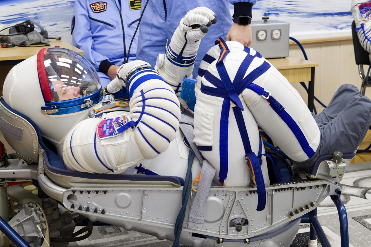 Expedition 65 prime crew member Oleg Novitskiy of Roscosmos has his Sokol suit pressure checked during a fit check to prepare for launch with crew mates Russian cosmonaut Pyotr Dubrov of Roscosmos and NASA astronaut Mark Vande Hei, Saturday, March 27, 2021 at the Baikonur Cosmodrome in Kazakhstan. They are scheduled to launch on a Soyuz rocket April 9. Photo Credit: (NASA/GCTC/Irina Spector)