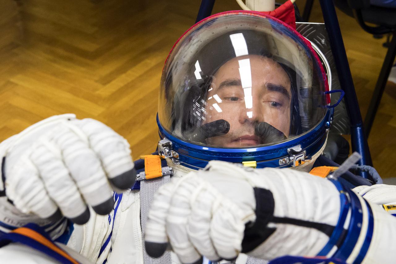 Expedition 65 prime crew member Pyotr Dubrov of Roscosmos has his Sokol suit pressure checked during a fit check to prepare for launch with crew mates Russian cosmonaut Oleg Novitskiy of Roscosmos and NASA astronaut Mark Vande Hei, Saturday, March 27, 2021 at the Baikonur Cosmodrome in Kazakhstan. They are scheduled to launch on a Soyuz rocket April 9. Photo Credit: (NASA/GCTC/Irina Spector)