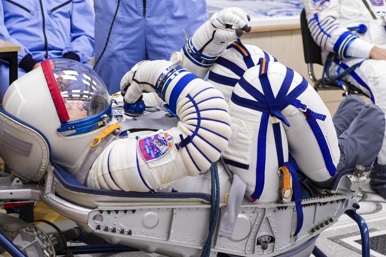 Expedition 65 prime crew member Pyotr Dubrov of Roscosmos has his Sokol suit pressure checked during a fit check to prepare for launch with crew mates Russian cosmonaut Oleg Novitskiy of Roscosmos and NASA astronaut Mark Vande Hei, Saturday, March 27, 2021 at the Baikonur Cosmodrome in Kazakhstan. They are scheduled to launch on a Soyuz rocket April 9. Photo Credit: (NASA/GCTC/Irina Spector)