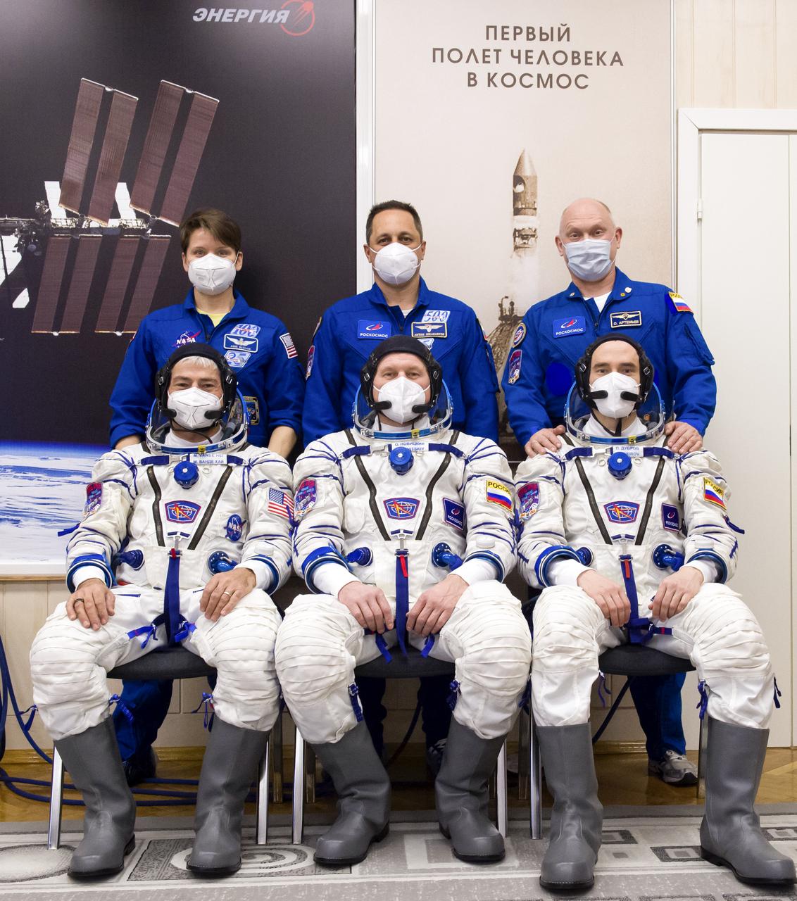 Expedition 65 prime crew member NASA astronaut Mark Vande Hei, front left, Russian cosmonauts Oleg Novitskiy of Roscosmos front center, and Pyotr Dubrov of Roscosmos, front right, pose for a photo with Expedition 65 backup crew members NASA astronaut Anne McClain, back left, and Russian cosmonauts Anton Shkaplerov of Roscosmos, back center, and Oleg Artemyev of Roscosmos, back right, after the prime crew’s Sokol suits were pressure checked in preparation for launch, Saturday, March 27, 2021 at the Baikonur Cosmodrome in Kazakhstan. They are scheduled to launch on a Soyuz rocket April 9. Photo Credit: (NASA/GCTC/Irina Spector)
