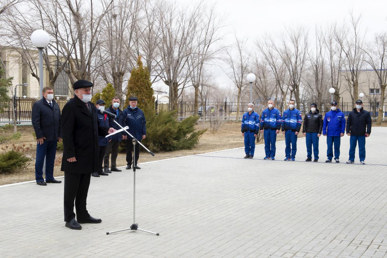 Expedition 65 prime and backup crew members are seen just prior to raising the flags of Russia, the United States, and Kazakhstan, Sunday, March 28, 2021, in traditional ceremonies outside the Cosmonaut Hotel in Baikonur, Kazakhstan. From left to right, Expedition 65 prime crew members, NASA astronaut Mark Vande Hei, Russian cosmonauts Oleg Novitskiy of Roscosmos and Pyotr Dubrov of Roscosmos, and Expedition 65 backup crew members NASA astronaut Anne McClain, and Russian cosmonauts Anton Shkaplerov of Roscosmos, and Oleg Artemyev of Roscosmos. The prime crew is scheduled to launch to the International Space Station on a Soyuz rocket April 9. Photo Credit: (NASA/GCTC/Irina Spector)