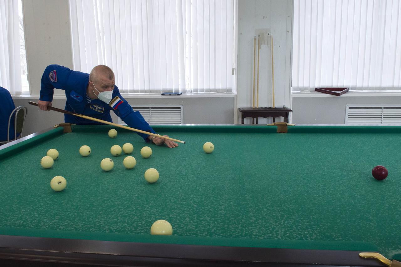 Expedition 65 prime crew member Russian cosmonaut Oleg Novitskiy of Roscosmos plays a game of billiards, Saturday, April 3, 2021, at the Cosmonaut Hotel in Baikonur, Kazakhstan. The prime crew, Novitskiy, NASA astronaut Mark Vande Hei, and Russian cosmonaut Pyotr Dubrov of Roscosmos are scheduled to launch to the International Space Station aboard the Soyuz MS-18 spacecraft on April 9. Photo Credit: (NASA/GCTC/Irina Spector)
