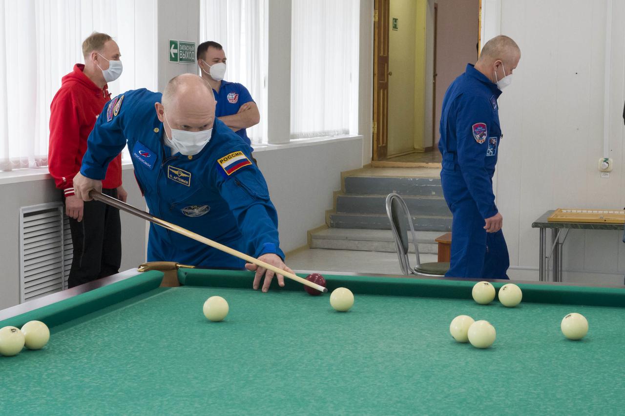 Expedition 65 backup crew member Russian cosmonaut Oleg Artemyev of Roscosmos plays a game of billiards, Saturday, April 3, 2021, at the Cosmonaut Hotel in Baikonur, Kazakhstan. The prime crew, NASA astronaut Mark Vande Hei, and Russian cosmonauts Oleg Novitskiy and Pyotr Dubrov of Roscosmos are scheduled to launch to the International Space Station aboard the Soyuz MS-18 spacecraft on April 9. Photo Credit: (NASA/GCTC/Irina Spector)