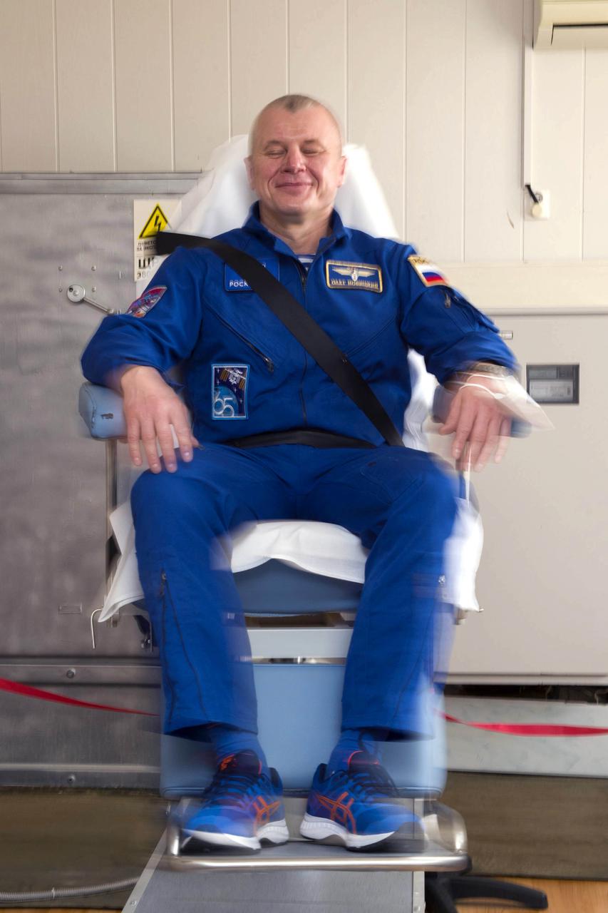 Expedition 65 prime crew member Russian cosmonaut Oleg Novitskiy of Roscosmos, takes part in spin chair training, Saturday, April 3, 2021, at the Cosmonaut Hotel in Baikonur, Kazakhstan. Novitskiy, NASA astronaut Mark Vande Hei, and Russian cosmonaut Pyotr Dubrov of Roscosmos are scheduled to launch to the International Space Station aboard the Soyuz MS-18 spacecraft on April 9. Photo Credit: (NASA/GCTC/Irina Spector)