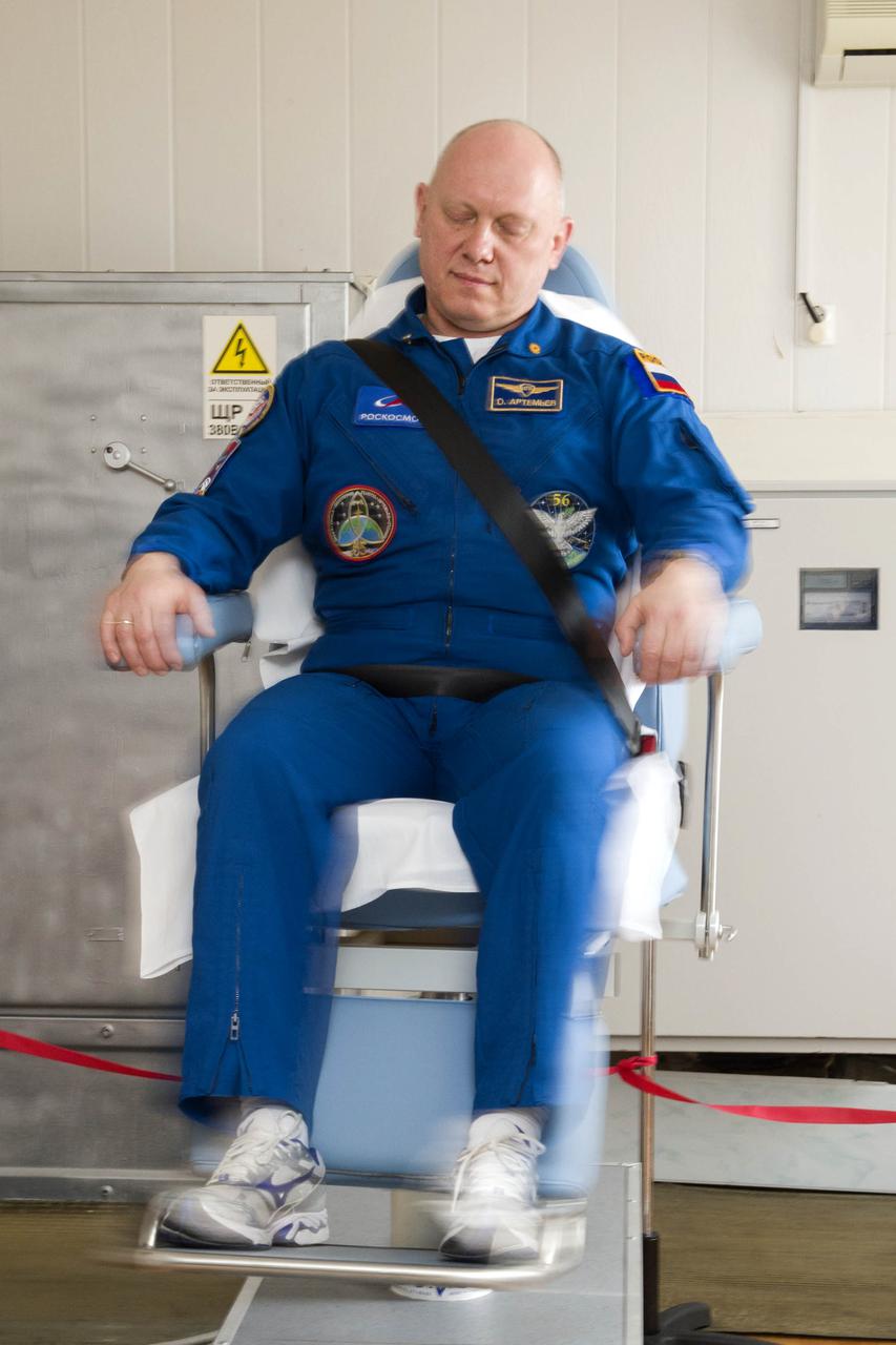 Expedition 65 backup crew member Russian cosmonaut Oleg Artemyev of Roscosmos, takes part in spin chair training, Saturday, April 3, 2021, at the Cosmonaut Hotel in Baikonur, Kazakhstan. The prime crew, Russian cosmonauts Oleg Novitskiy and Pyotr Dubrov of Roscosmos, and NASA astronaut Mark Vande Hei, are scheduled to launch to the International Space Station aboard the Soyuz MS-18 spacecraft on April 9. Photo Credit: (NASA/GCTC/Irina Spector)