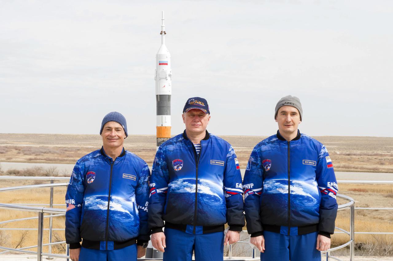 Expedition 65 prime crew members NASA astronaut Mark Vande Hei, left, and Russian cosmonauts Oleg Novitskiy, center, and Pyotr Dubrov of Roscosmos, pose for a photo after a tree planting ceremony that is part of traditional pre-launch activities, Saturday, April 3, 2021, in Baikonur, Kazakhstan. The trio are scheduled to launch to the International Space Station aboard the Soyuz MS-18 spacecraft on April 9. Photo Credit: (NASA/GCTC/Irina Spector)