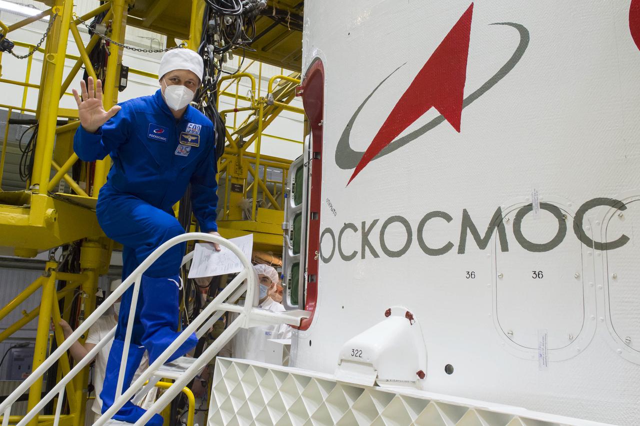 Expedition 65 backup crew member Anton Shkaplerov of Roscosmos is seen heading inside the Soyuz MS-18 spacecraft during a final fit check with fellow Russian cosmonaut Oleg Artemyev of Roscosmos, and NASA astronaut Anne McClain, Sunday, April 4, 2021 at the Baikonur Cosmodrome in Kazakhstan. The prime crew is scheduled to launch to the International Space Station on a Soyuz rocket April 9. Photo Credit: (NASA/GCTC/Irina Spector)