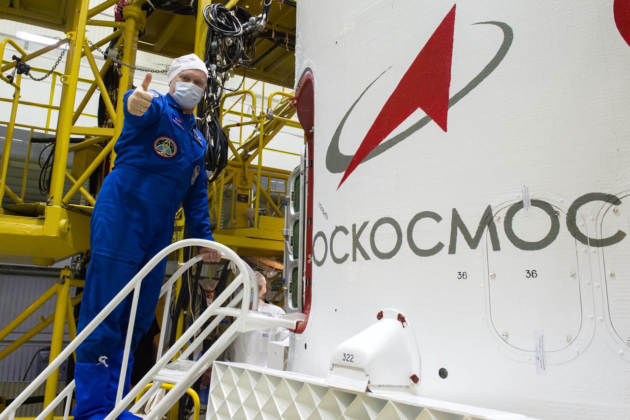 Expedition 65 backup crew member Oleg Artemyev of Roscosmos gives a thumbs up as he climbs inside the Soyuz MS-18 spacecraft during a final fit check with fellow Russian cosmonaut Anton Shkaplerov of Roscosmos, and NASA astronaut Anne McClain, Sunday, April 4, 2021 at the Baikonur Cosmodrome in Kazakhstan. The prime crew is scheduled to launch to the International Space Station on a Soyuz rocket April 9. Photo Credit: (NASA/GCTC/Irina Spector)