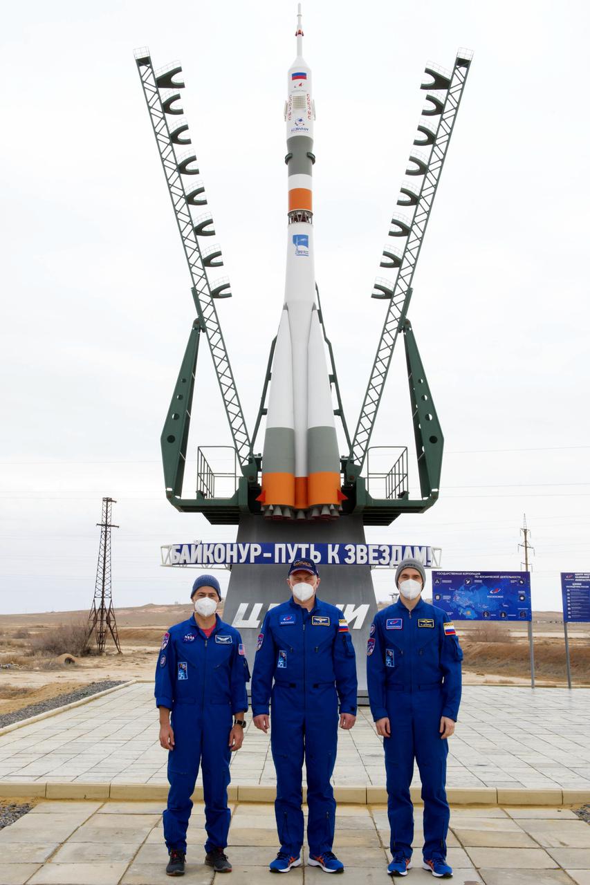 Expedition 65 prime crew members NASA astronaut Mark Vande Hei, left, and Russian cosmonauts Oleg Novitskiy, center, and Pyotr Dubrov of Roscosmos pose for a photo after the final fit check to prepare for launch Sunday, April 4, 2021 at the Baikonur Cosmodrome in Kazakhstan. The trio are scheduled to launch to the International Space Station aboard the Soyuz MS-18 spacecraft on April 9. Photo Credit: (NASA/GCTC/Irina Spector)