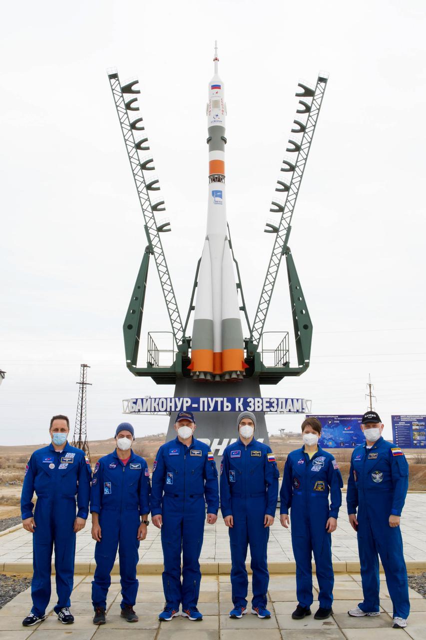 From left to right, Expedition 65 backup crew member Anton Shkaplerov of Roscosmos, Expedition 65 prime crew members, NASA astronaut Mark Vande Hei, and Russian cosmonauts Oleg Novitskiy, and Pyotr Dubrov of Roscosmos, backup crew members NASA astronaut Anne McClain and Russian cosmonaut Oleg Artemyev of Roscosmos, pose for a photo after the final fit check to prepare for launch Sunday, April 4, 2021 at the Baikonur Cosmodrome in Kazakhstan. The prime crew is scheduled to launch to the International Space Station aboard the Soyuz MS-18 spacecraft on April 9. Photo Credit: (NASA/GCTC/Irina Spector)