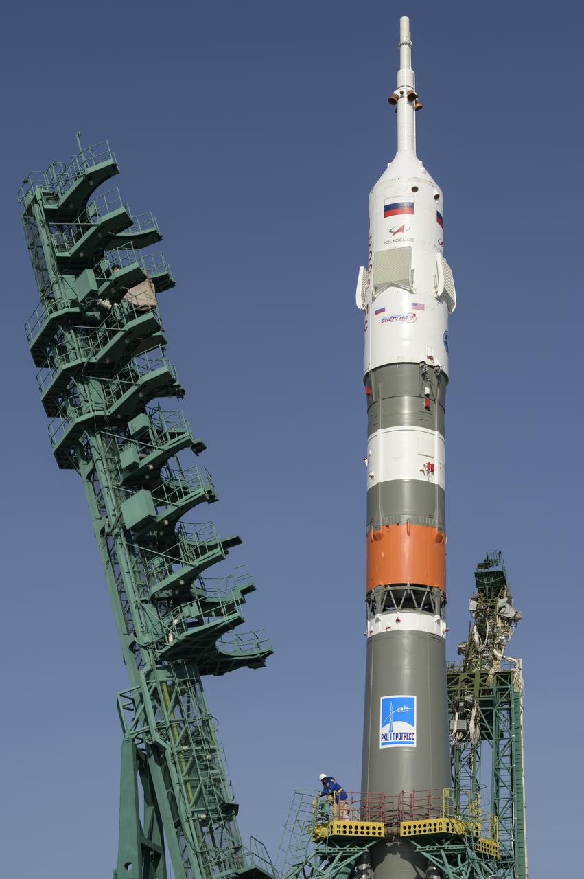 The service structure is lifted into position around the Soyuz rocket, Tuesday, April 6, 2021, at site 31 of the Baikonur Cosmodrome in Kazakhstan. Expedition 65 NASA astronaut Mark Vande Hei, Roscosmos cosmonauts Pyotr Dubrov and Oleg Novitskiy are scheduled to launch aboard their Soyuz MS-18 spacecraft on April 9. Photo Credit: (NASA/Bill Ingalls)